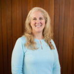 Smiling woman in a turquoise sweater Smiling woman in a turquoise sweater
