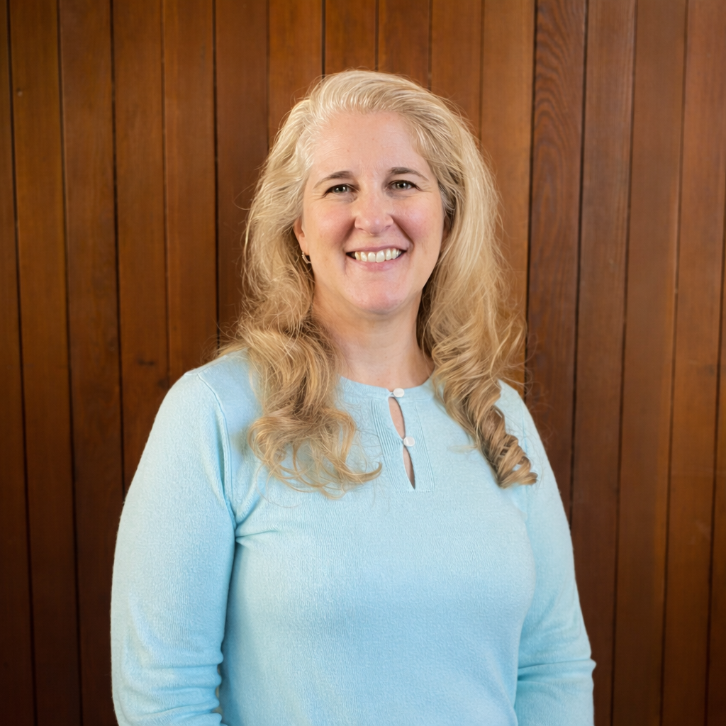 Smiling woman in a turquoise sweater